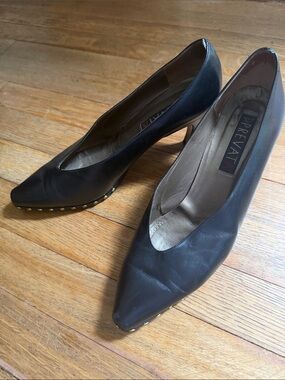 Prevata Black Leather Pointed Toe Pumps with Gold Stud Accents